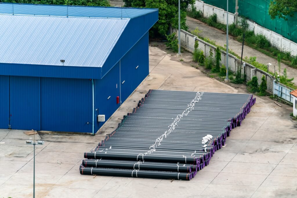 Warehouse with Pipes and tube on yard.